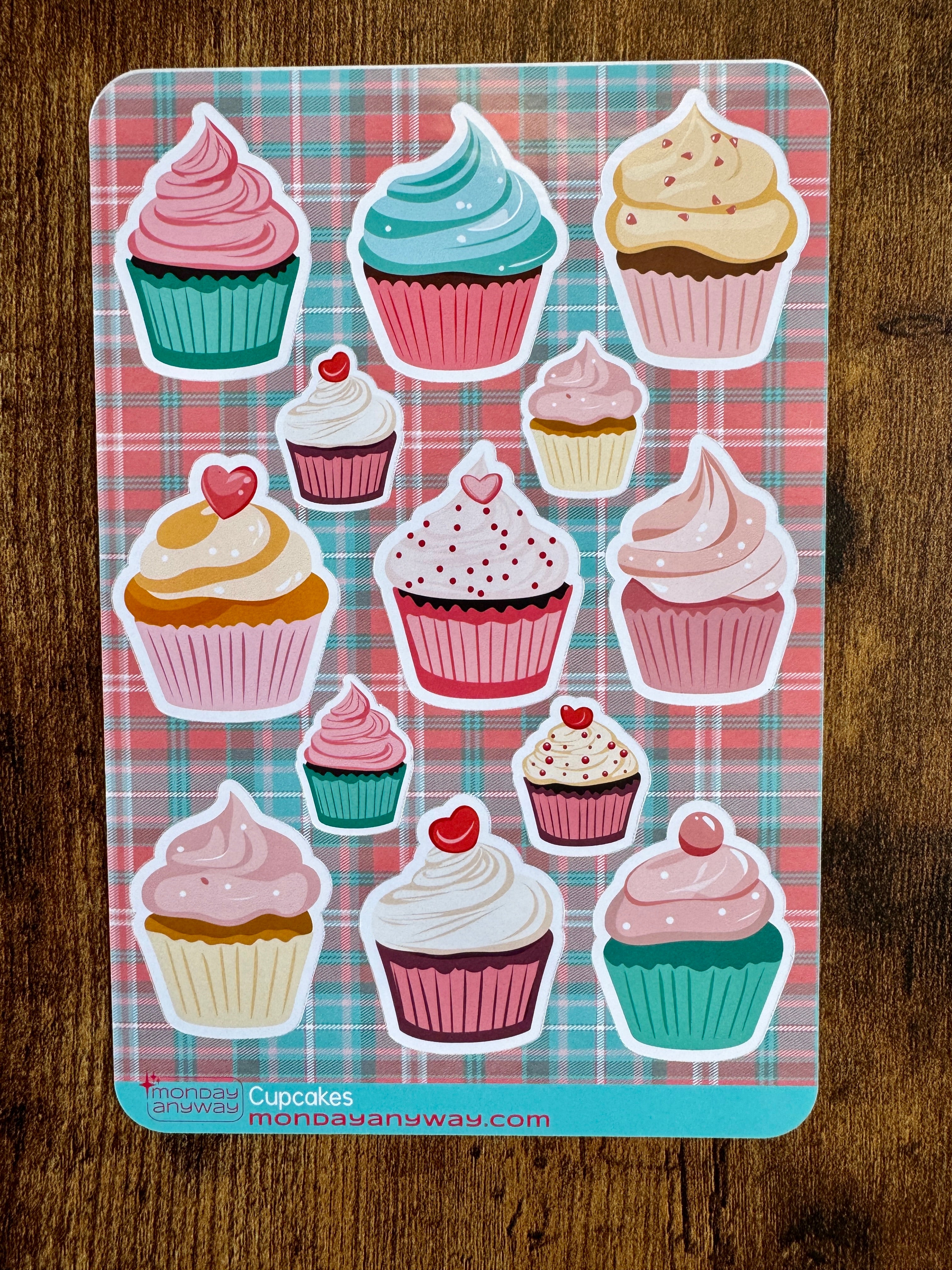 Sheet of cupcake stickers on a plaid background with 'mondayanyway' branding.