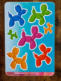 Colorful balloon dog stickers on a blue backing.