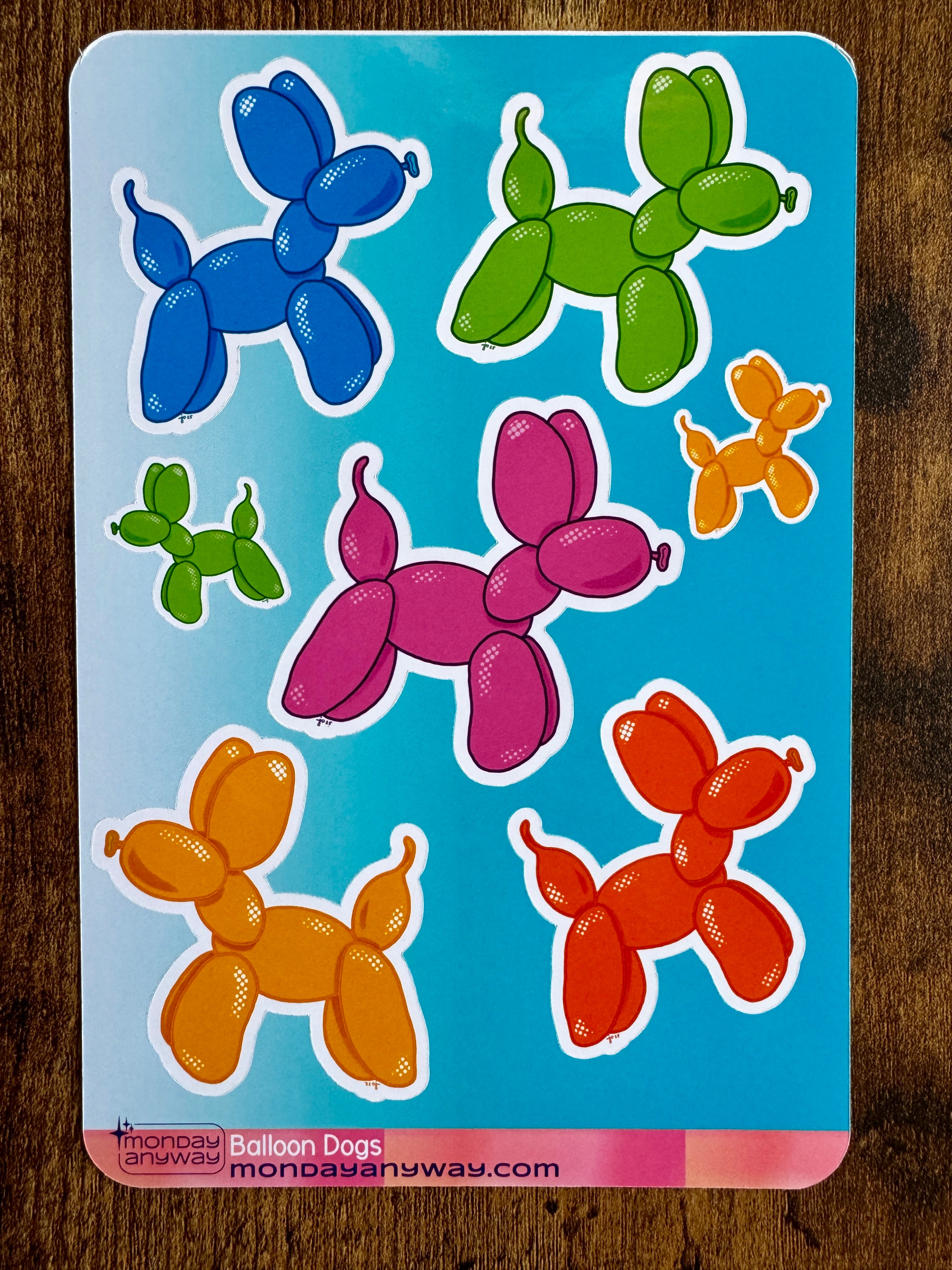 Colorful balloon dog stickers on a blue backing.
