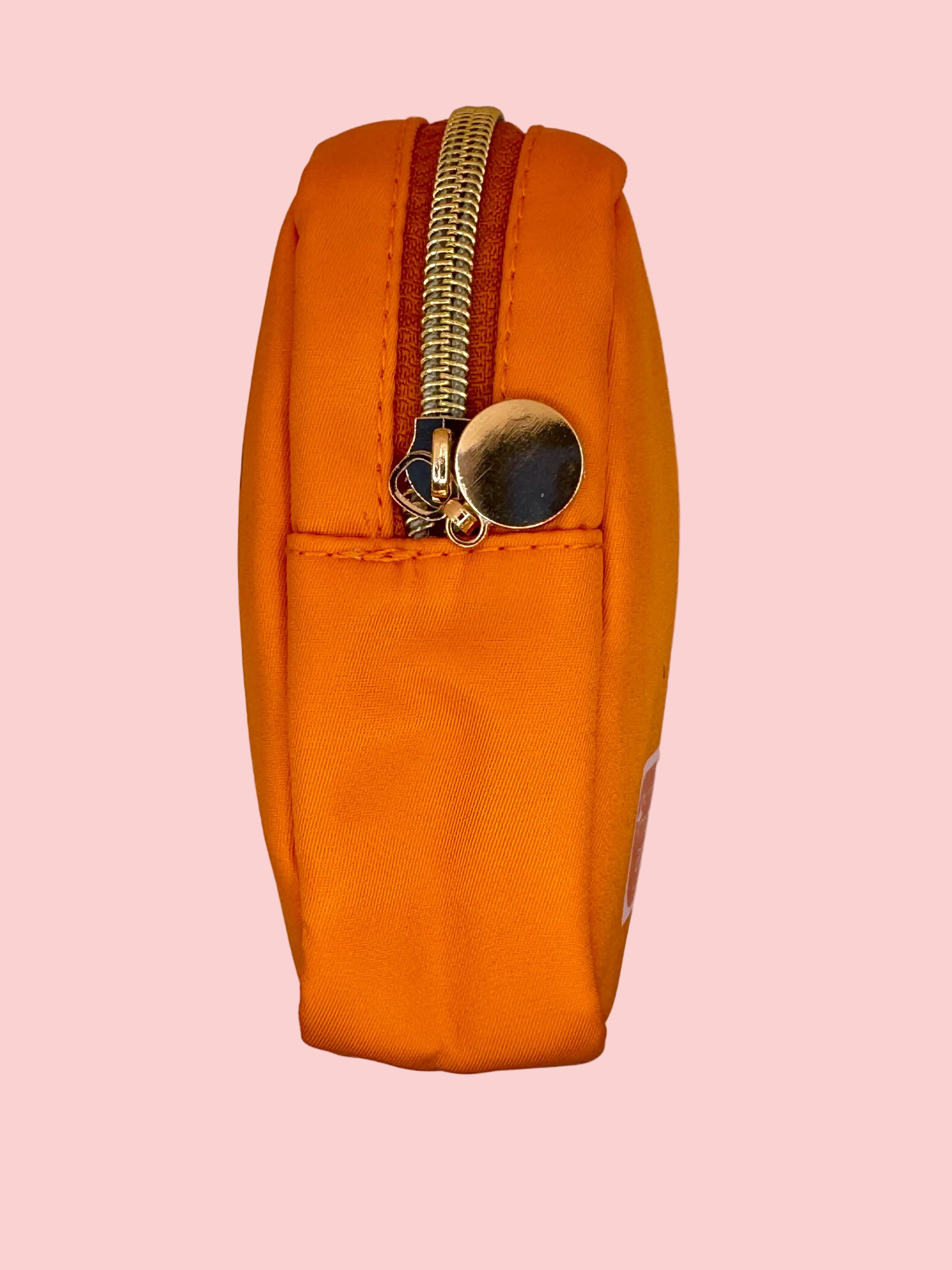 Orange pouch with a gold zipper