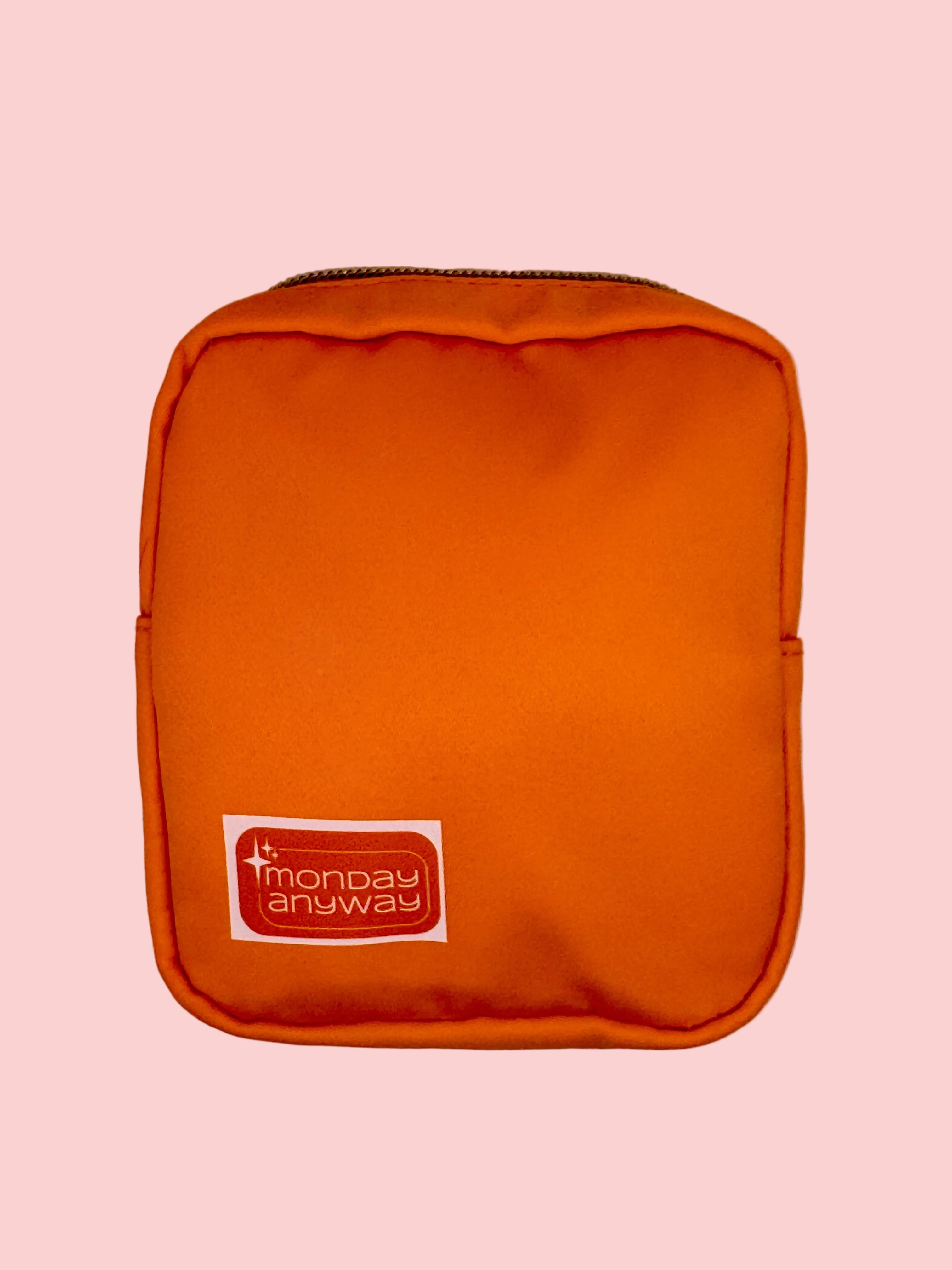 Orange pouch with a Monday Anyway brand logo 