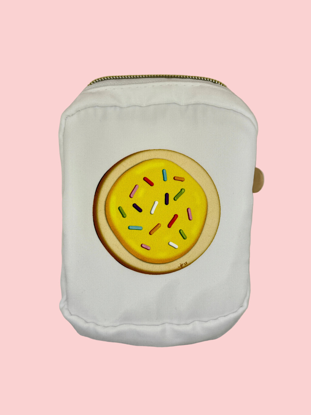 White pouch with a yellow donut design featuring colorful sprinkles