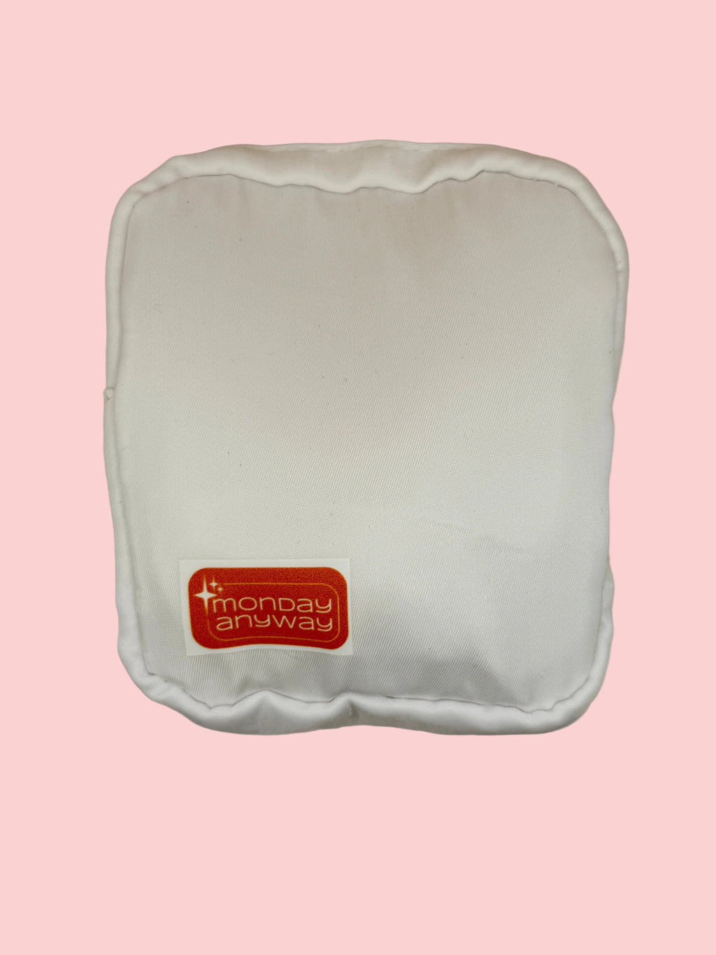 White zip pouch with a red 'Monday Anyway' label 