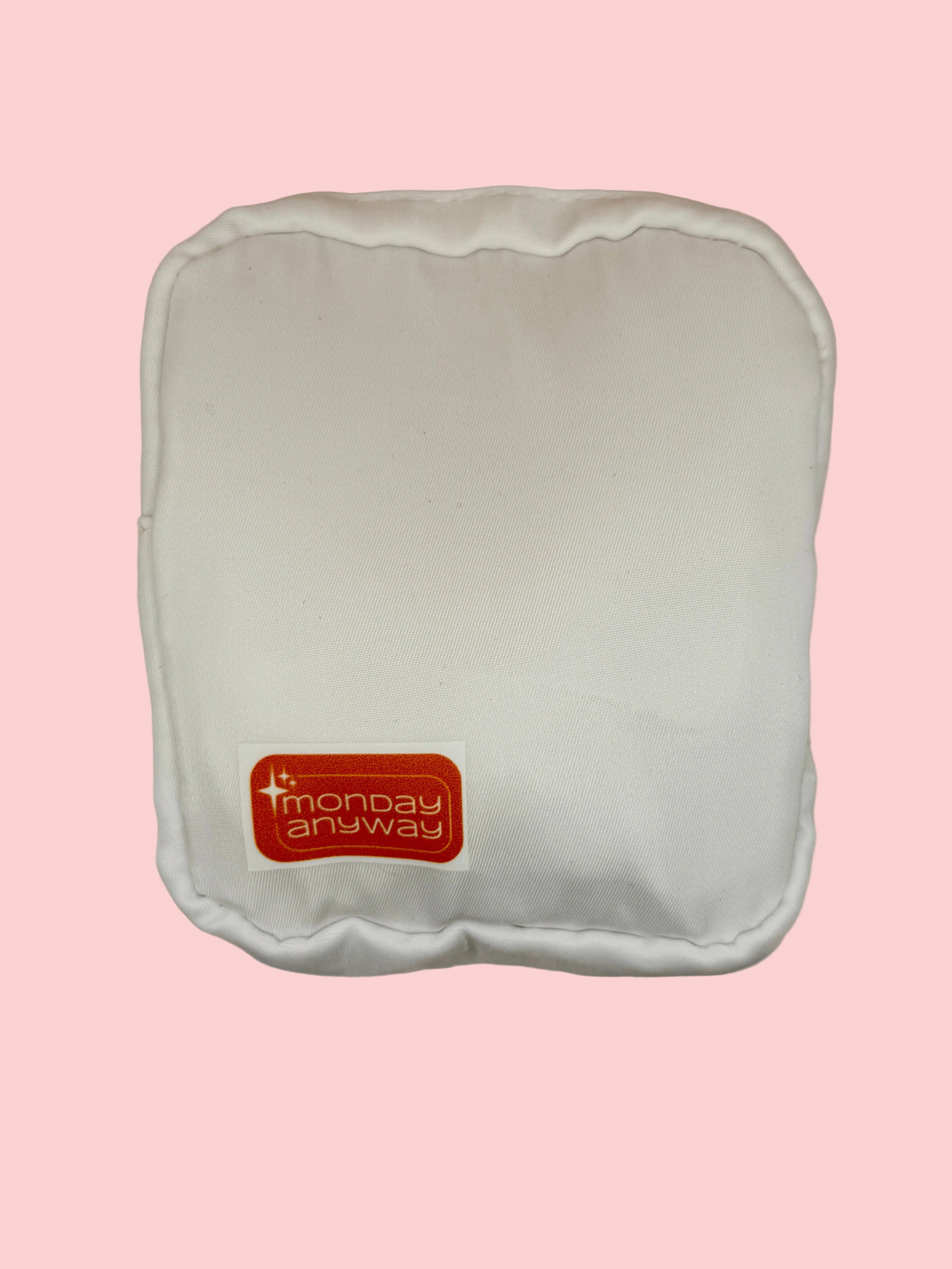White zip pouch with a red 'Monday Anyway' label 