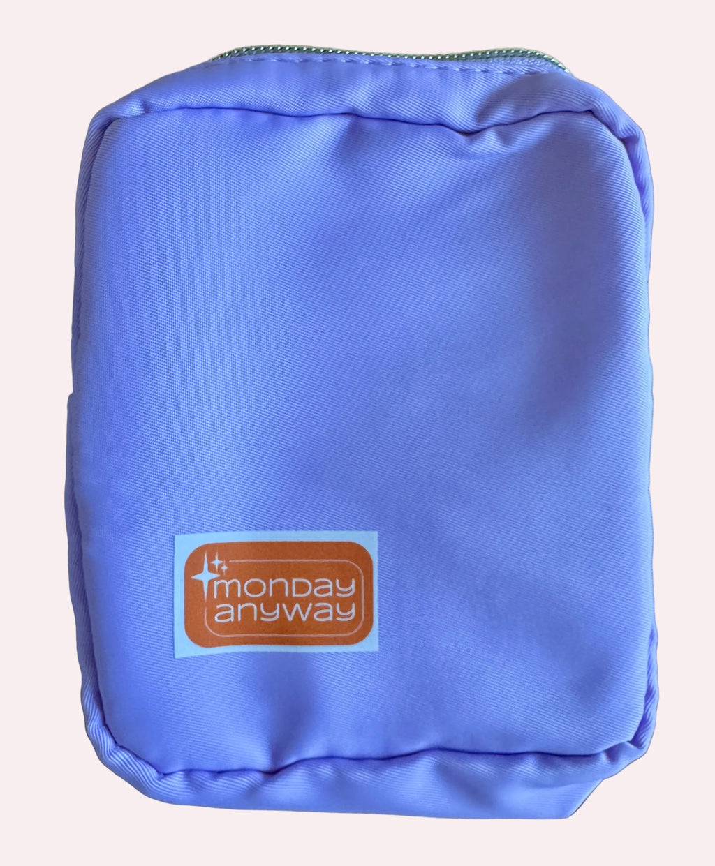 Purple pouch with 'Monday Anyway' logo 