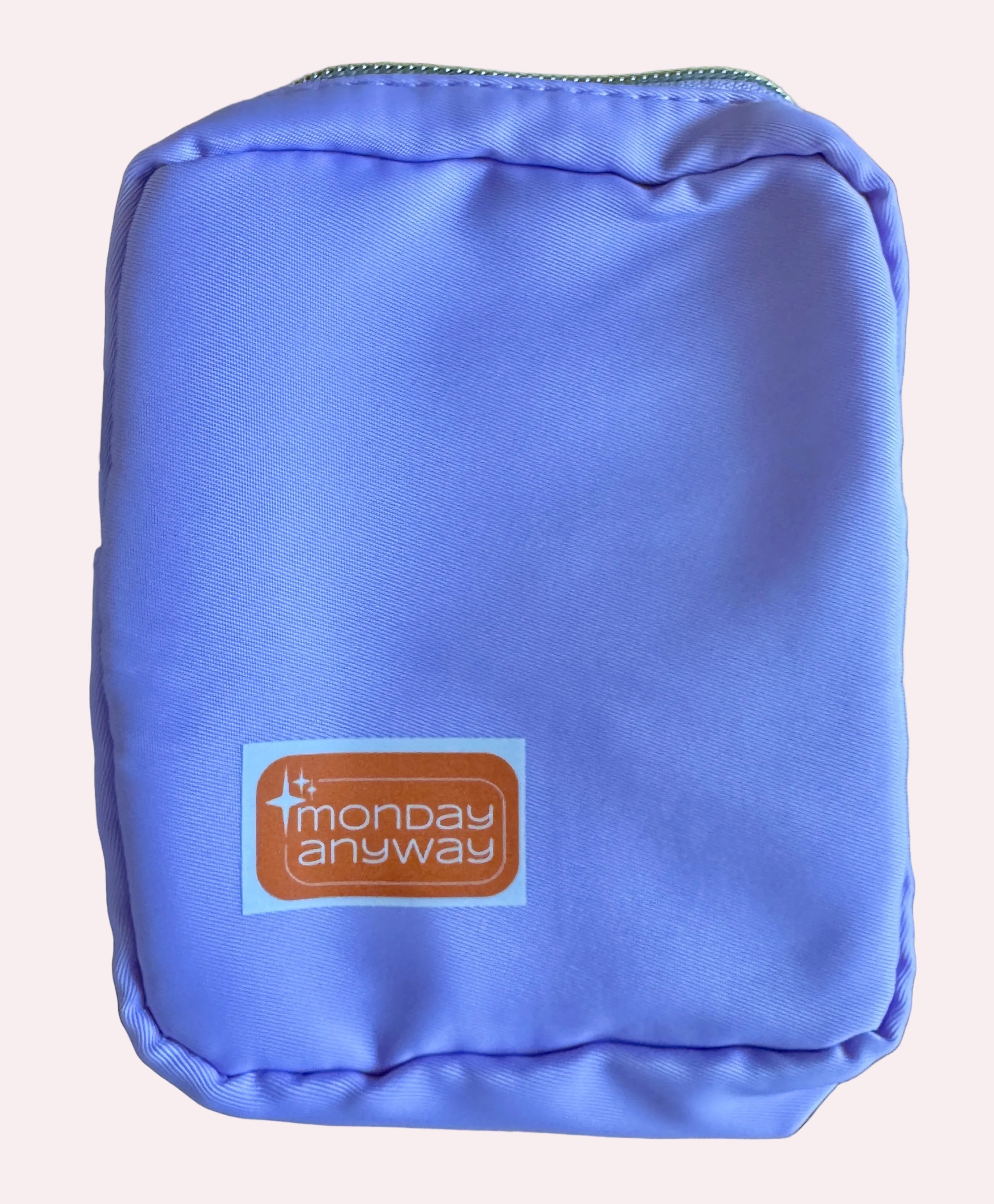 Purple pouch with 'Monday Anyway' logo 