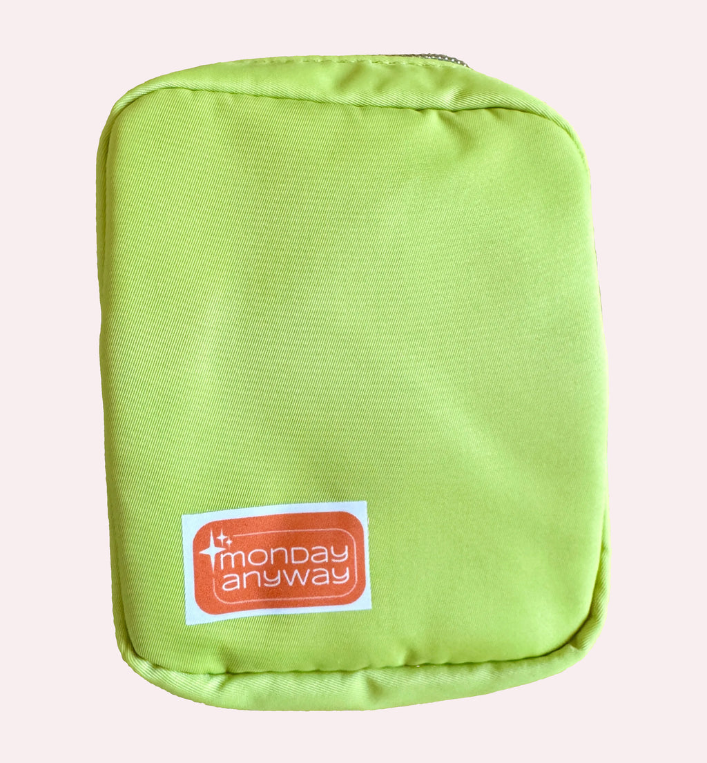 Green pouch with 'Monday Anyway' label 