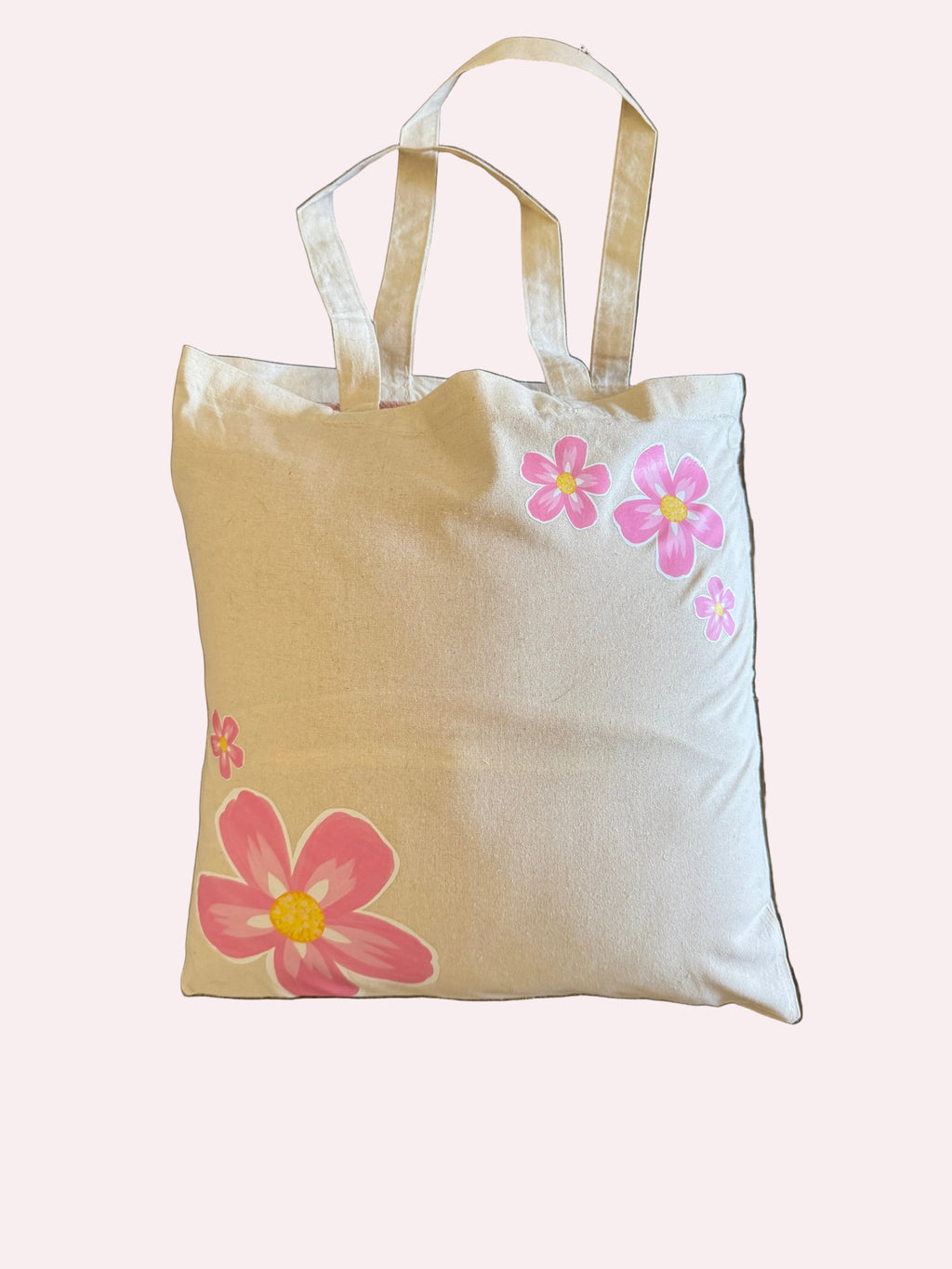 Beige tote bag with pink floral designs