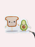 Avocado and toast holding hands glossy sticker