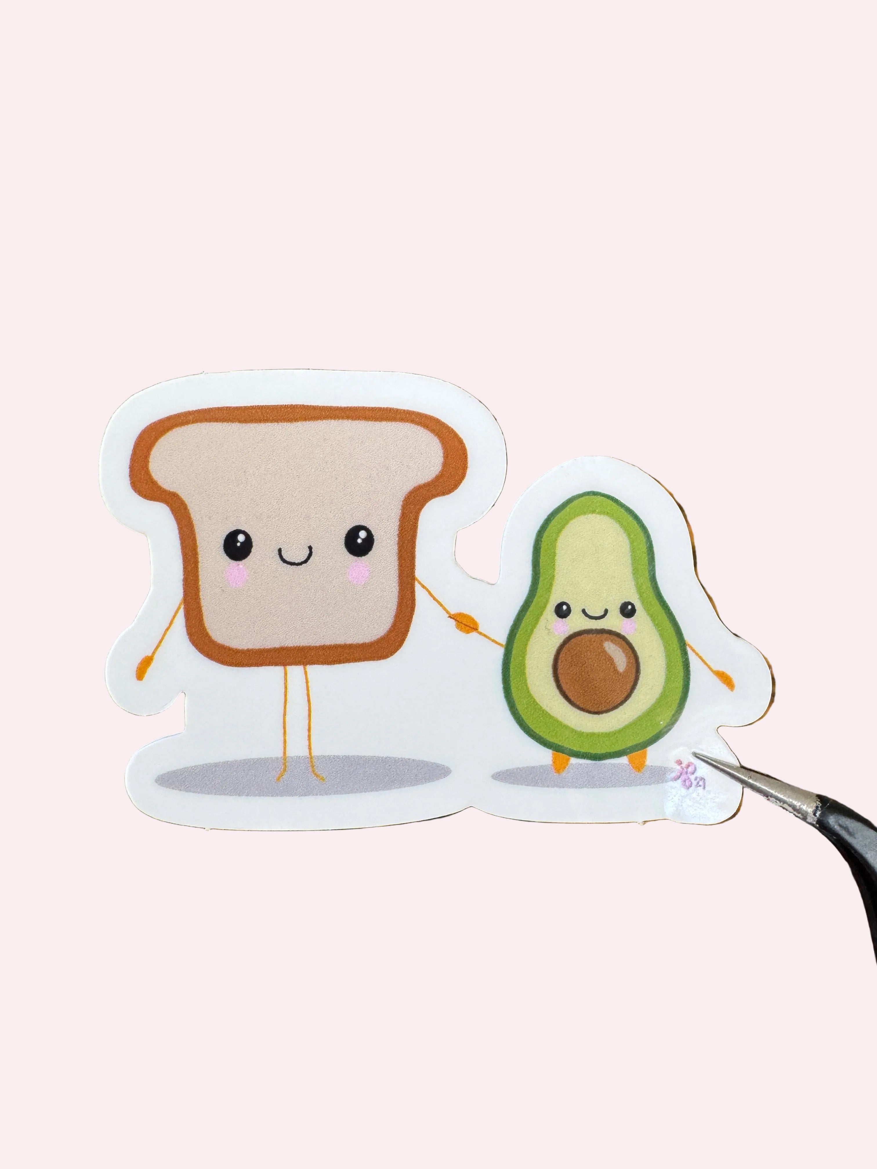 Avocado and toast holding hands glossy sticker