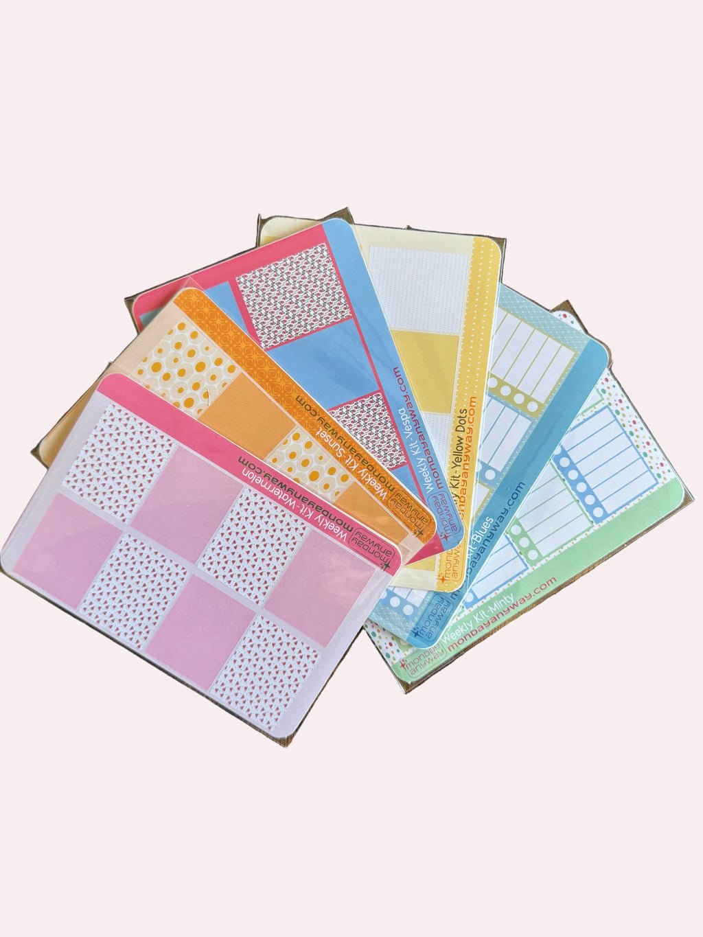 Colorful planner stickers on a wooden surface