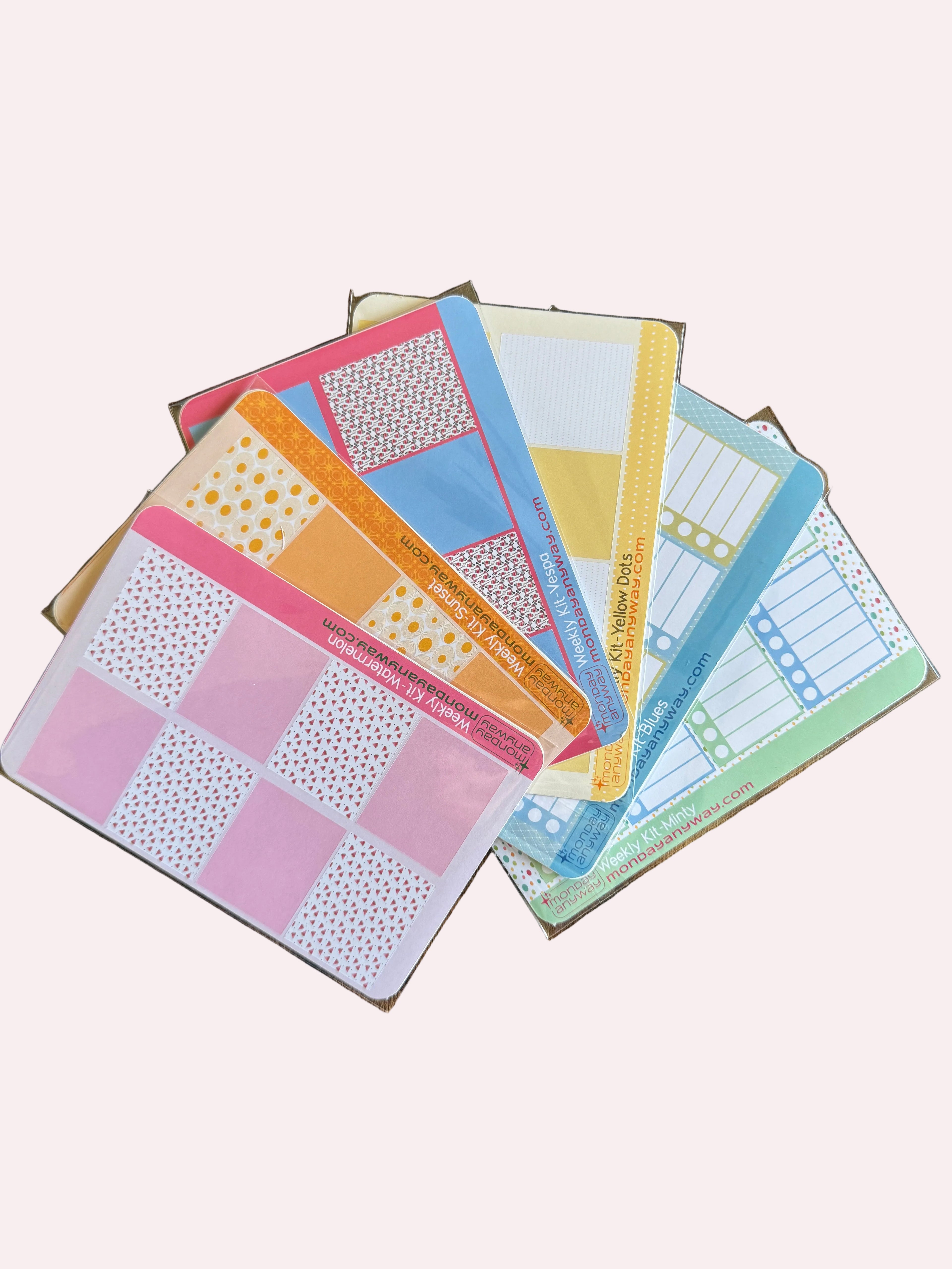 Colorful planner stickers on a wooden surface